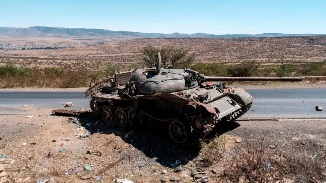 A damaged tank stands on a road north of Mekele, the capital of Tigray on February 26, 2021