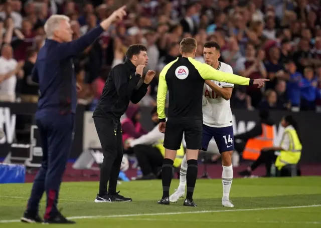 Ryan Mason and Ivan Perisic speak to the referee