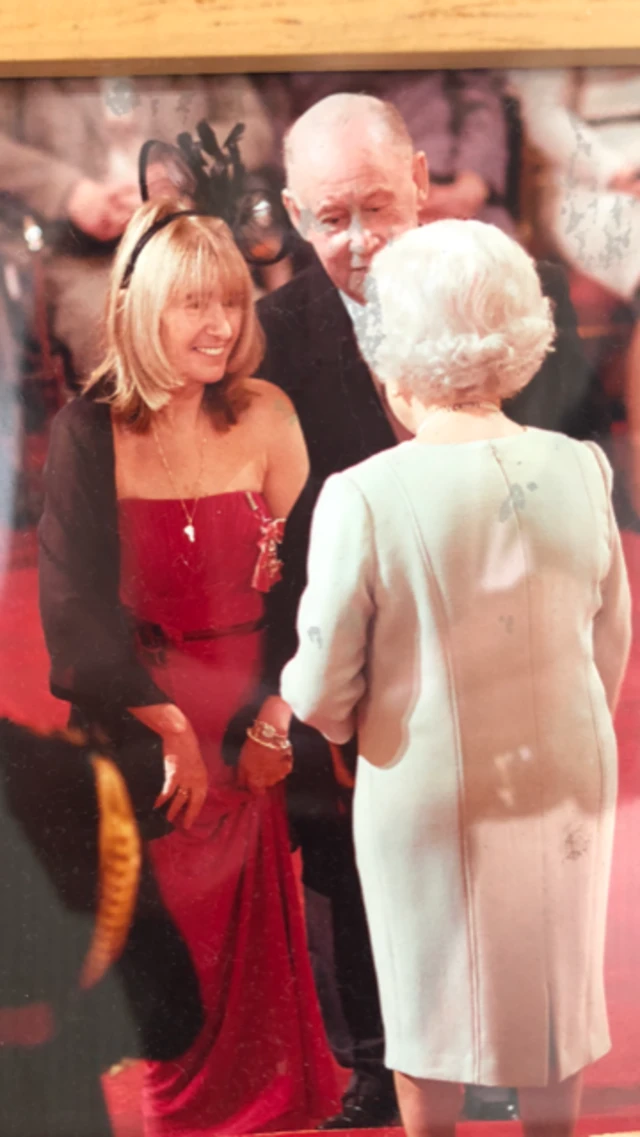 Tony and Maureen Coumbe receiving their MBE.