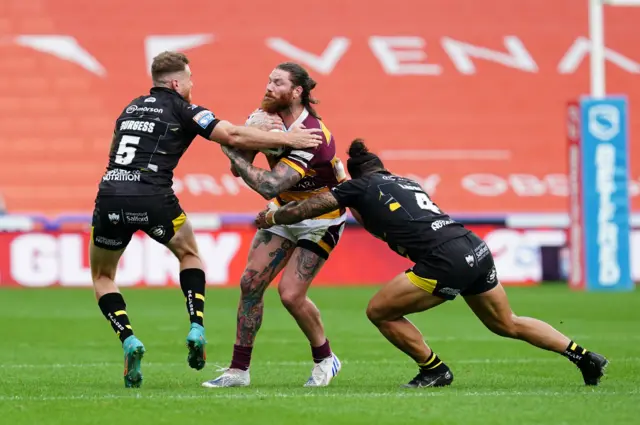 Chris McQueen takes on the Salford defenders