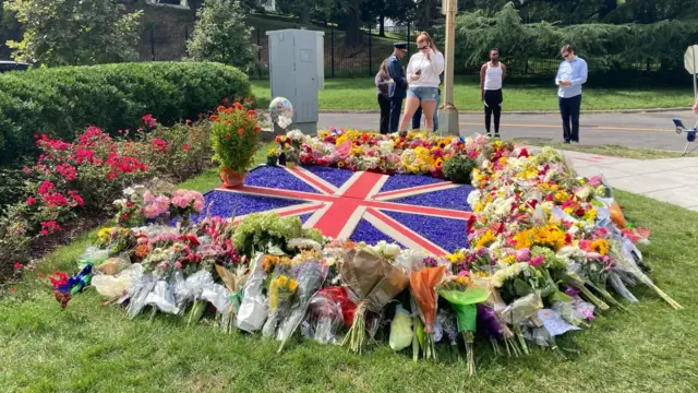 Flowers were left outside the embassy