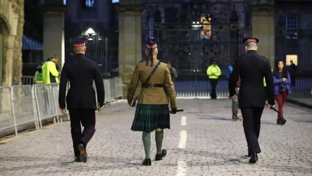 People pay their respects at Holyroodhouse following the death of Queen Elizabeth II, Edinburgh, Scotland - 09 Sep 2022