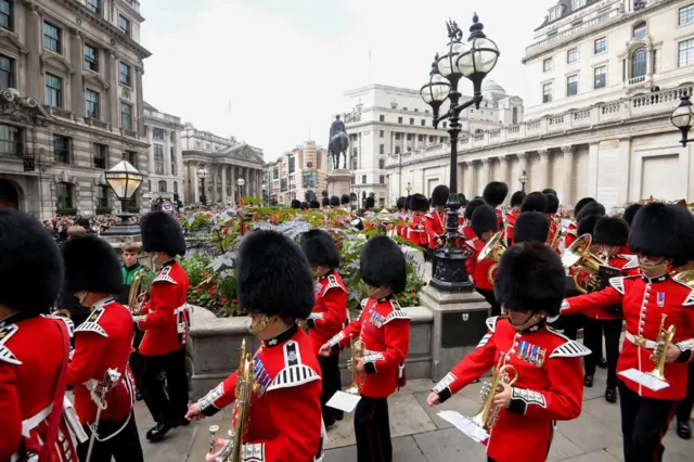 Members of a military band march after the Proclamation of Accession of King Charles III at the Royal Exchange in the City of London