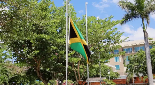 Jamaican flag at half-mast