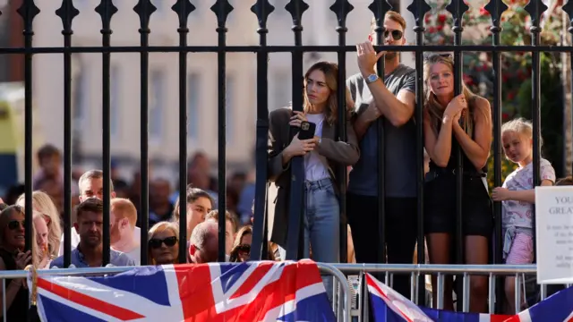 People gather outside Windsor Castle, following the passing of Britain's Queen Elizabeth, in Windsor, Britain, September 10, 2022.