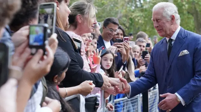 Britain"s King Charles meets well-wishers as he returns to Clarence House from Buckingham Palace,