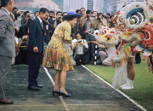 The Queen meets a Chinese dragon in Hong Kong during the Royal Tour of 1975