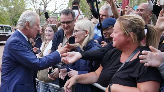 Britain"s King Charles meets well-wishers as he returns to Clarence House from Buckingham Palace,