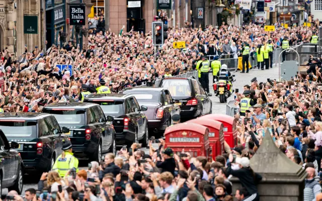 The cortege drives along the Royal Mile in Edinburgh