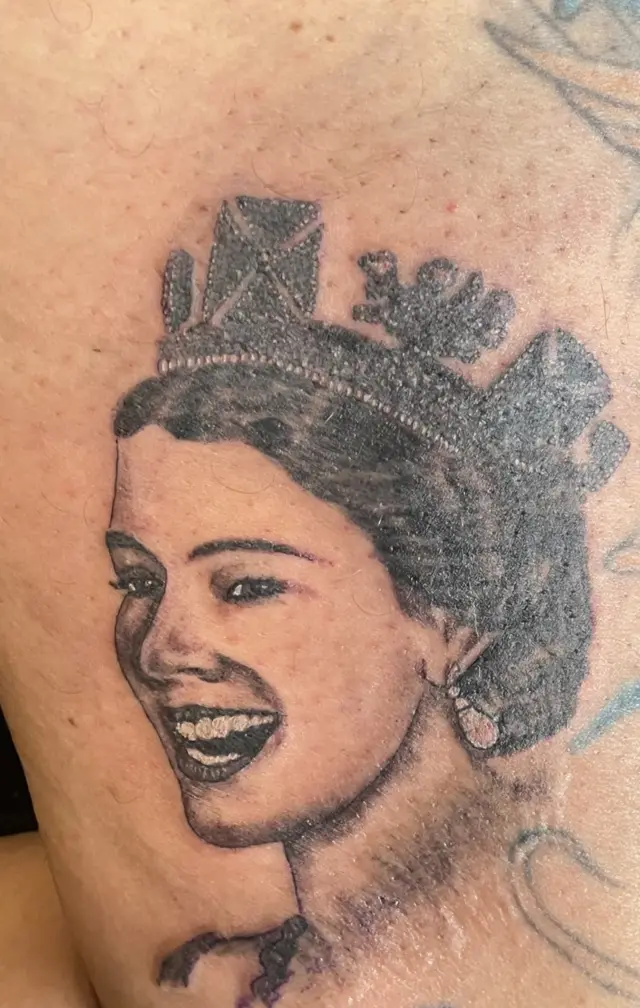 A tattoo of the Queen by Michael Purkiss, inked on his own leg