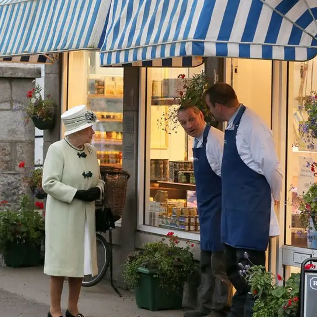 File photo dated 27/9/2012 of Queen Elizabeth II talks to the local butchers, in Ballater, Aberdeenshire