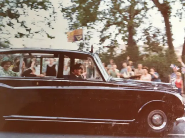 A glimpse of the Queen in the back of the royal car