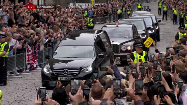 The cortege travels down the Royal Mile