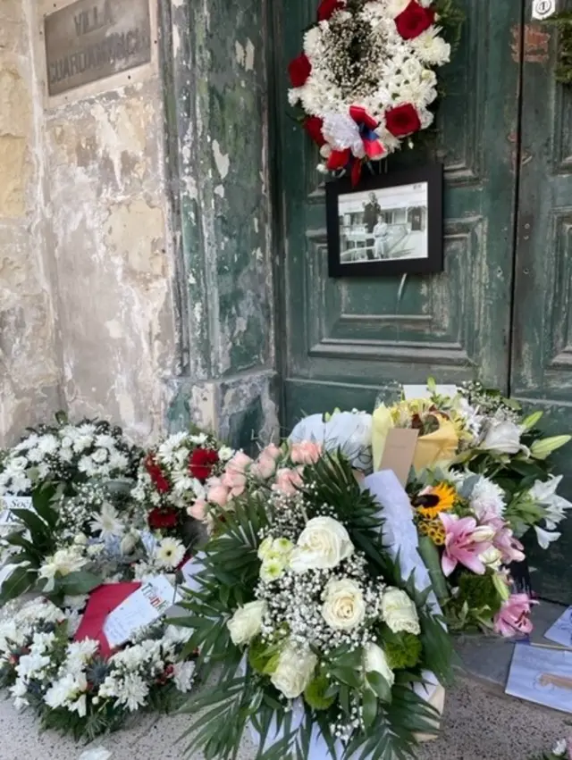 People leave flowers and cards on doorsteps in Malta