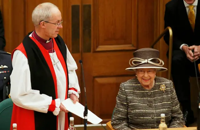 The Queen performing her duty as head of the Church of England with the Archbishop of Canterbury, the church's most senior cleric