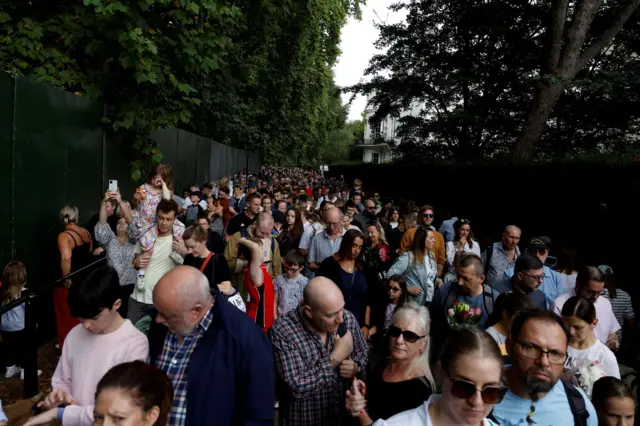 People queue in Green Park