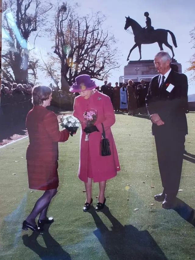 Jackie Downey presents flowers to the Queen at Windsor Great Park, Berkshire, in 2003