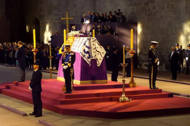 Then-Prince Charles and the Duke of York stand vigil beside the Queen Mother's coffin in 2002