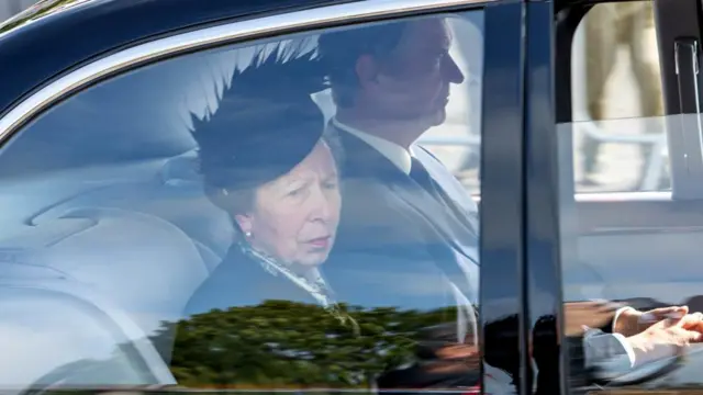 The Princess Royal and her husband Admiral Sir Tim Laurence travel behind the hearse carrying the coffin of Queen Elizabeth II, draped with the Royal Standard of Scotland, passing through Aberdeen as it continues its journey to Edinburgh from Balmoral, on 11 September 2022