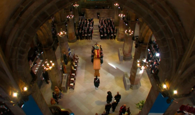 The Queen's coffin is placed on the catafalque