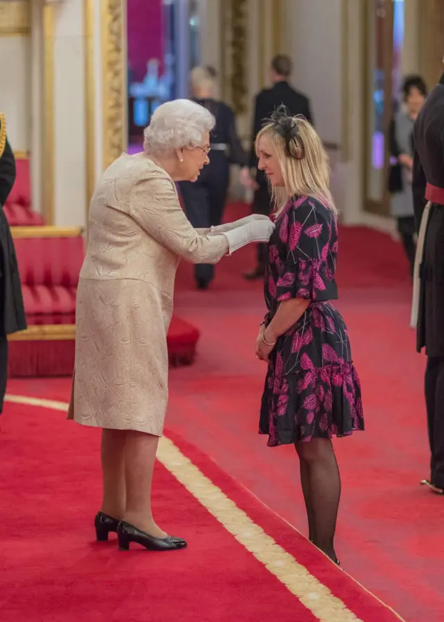 Becky Mitchell MBE with the Queen