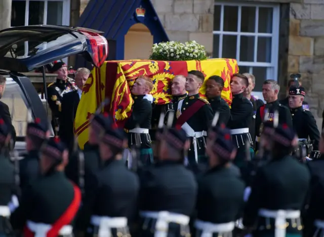 The Queen's coffin is placed in the hearse