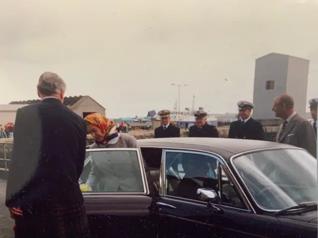 The Queen getting out of her car