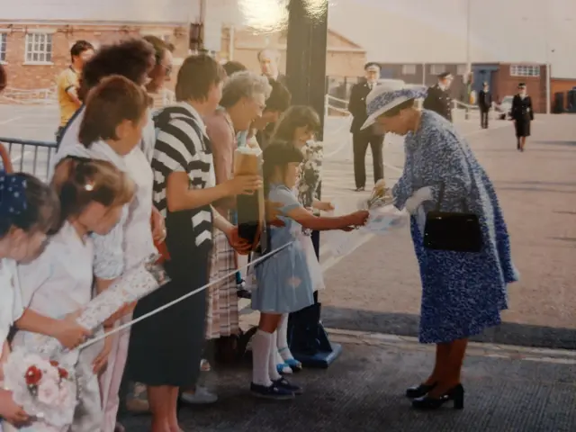 The Queen meeting two children at Portsmouth Dockyard