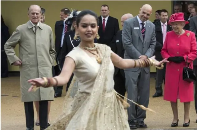 Sonia Tandon dancing in front of the Queen