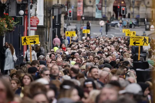 People in a queue to enter St Giles' Cathedral in Edinburgh