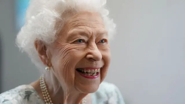 Queen Elizabeth II smiling, during a visit in July