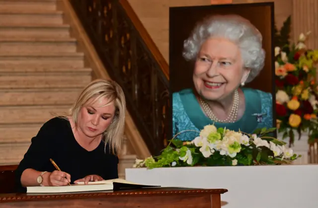 Michelle O'Neill signs book of condolences