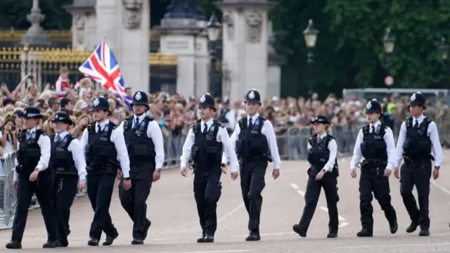 Police are seen outside of Buckingham Palace, London, following the death of Queen Elizabeth II on Thursday.