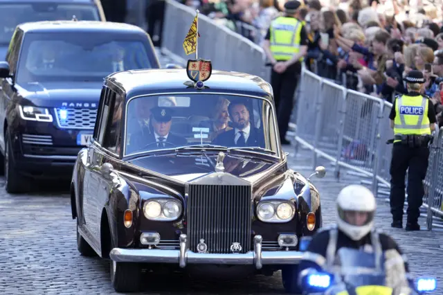 Car carrying King Charles and Camilla