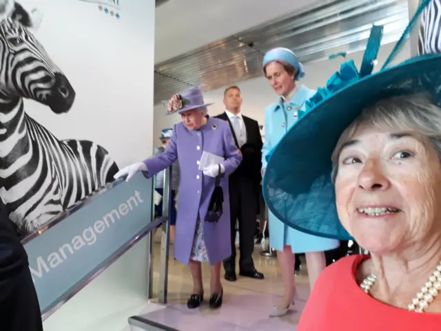 The Queen walking down steps at the Epsom Derby