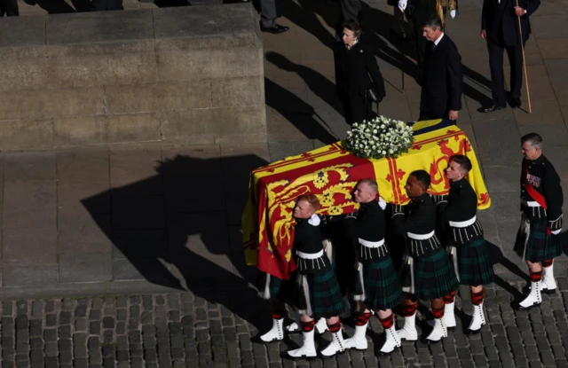 The Queen's coffin is being transported to Edinburgh airport where it will be flown to London later on Tuesday