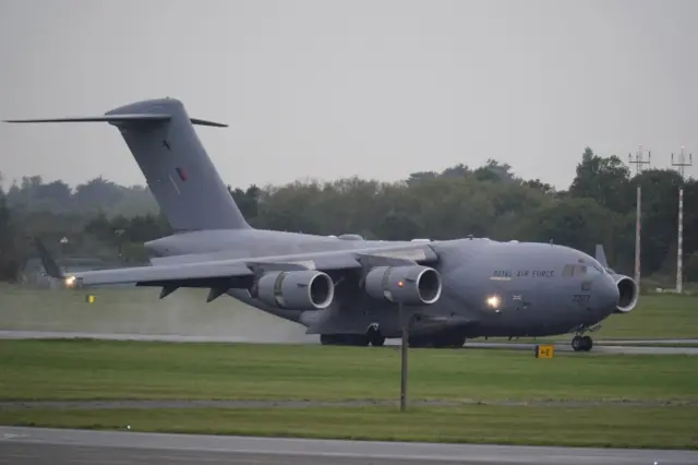 Plane carrying Queen's coffin lands in RAF Northolt