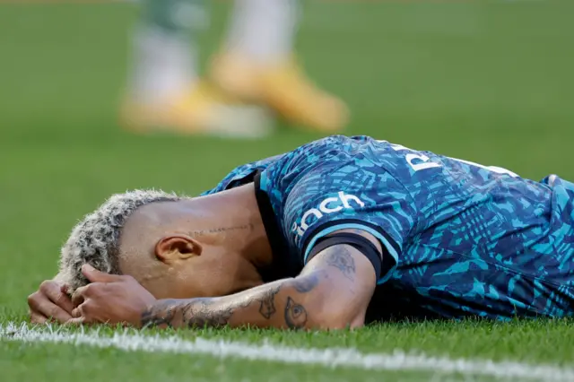 Richarlison lies face down after losing to Sporting Lisbon