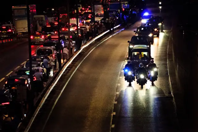 The Queen's hearse travels along the A40 to Buckingham Palace from RAF Northolt