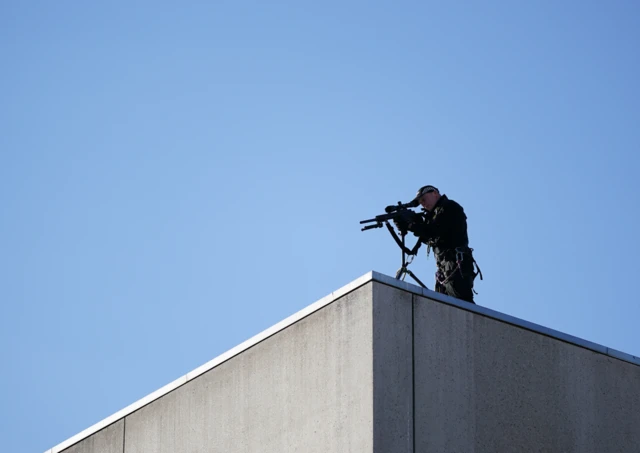 Armed sniper on the roof of a building in Edinburgh