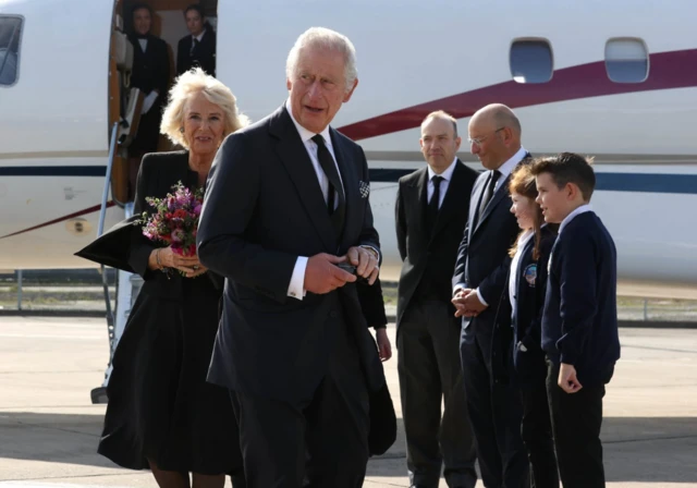 King Charles III and the Queen Consort arrive at Belfast City Airport