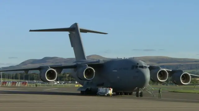 The RAF C-17 Globemaster carrying the Queen's coffin to London