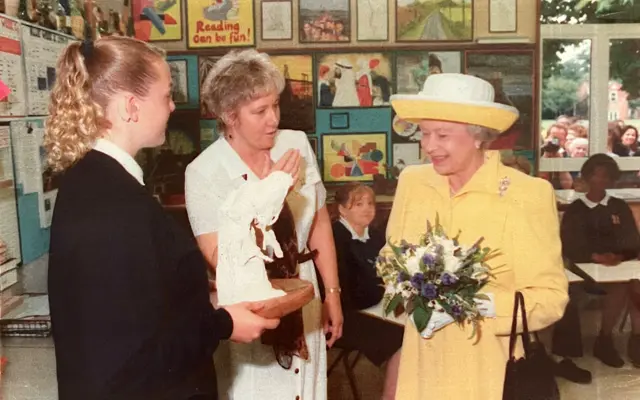 Gemma Matthews (then Whitham), left, with her art teacher Miss Eccles (centre), presenting Gemma’s creation to the Queen