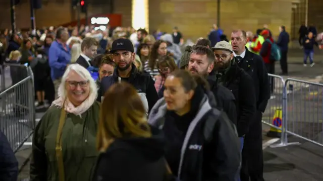 A group smiling in the line