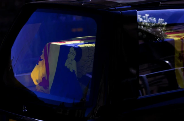 The Queen's casket is draped with the Royal Standard in Scotland