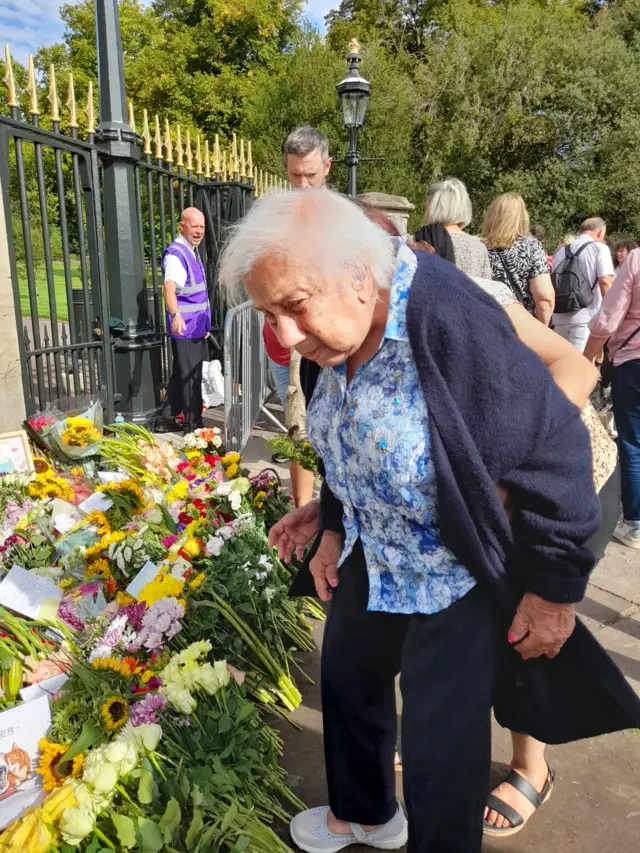 Dallas Gill, from West London, lays flowers at Windsor Castle