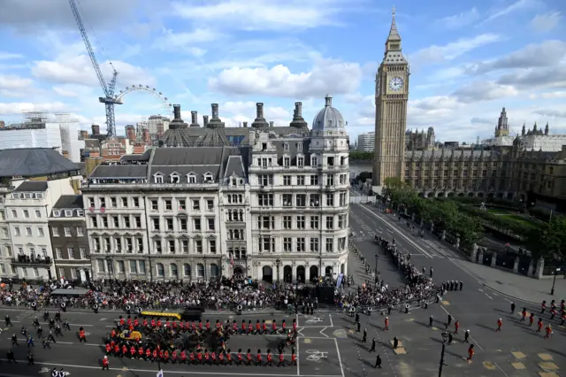 Aerial view as procession approaches the Palace of Westminster