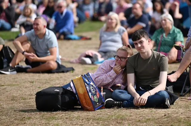 People watch the procession for the Lying-in State of Queen Elizabeth II at the Hyde Park screening site