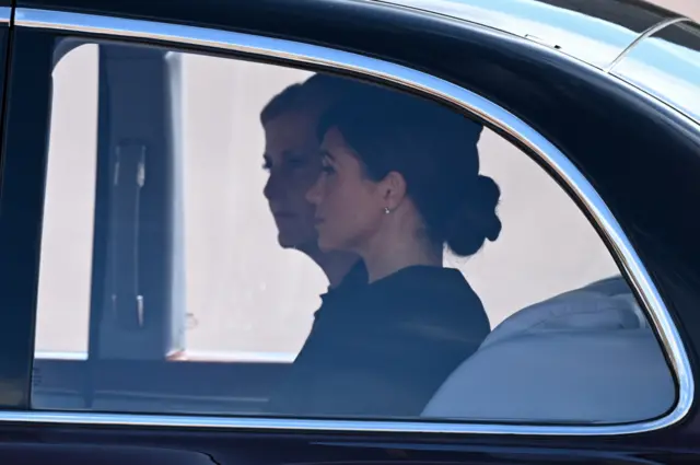 Sophie, Countess of Wessex and Meghan, Duchess of Sussex are driven in a car during the procession for the Lying-in State of Queen Elizabeth II on September 14, 2022 in London, England. Queen Elizabeth II's coffin is taken in procession on a Gun Carriage of The King's Troop Royal Horse Artillery from Buckingham Palace to Westminster Hall where she will lay in state until the early morning of her funeral.