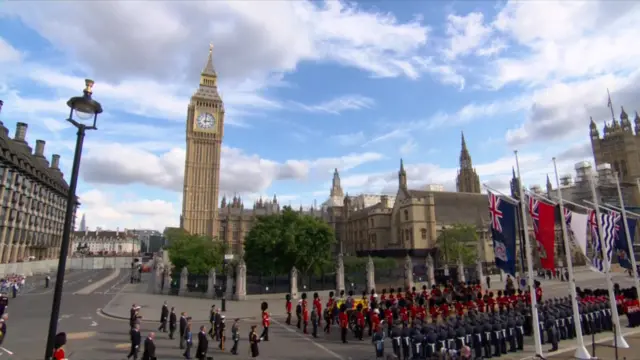 The Queen's procession with the Elizabeth Tower and the Houses of Parliament in the background